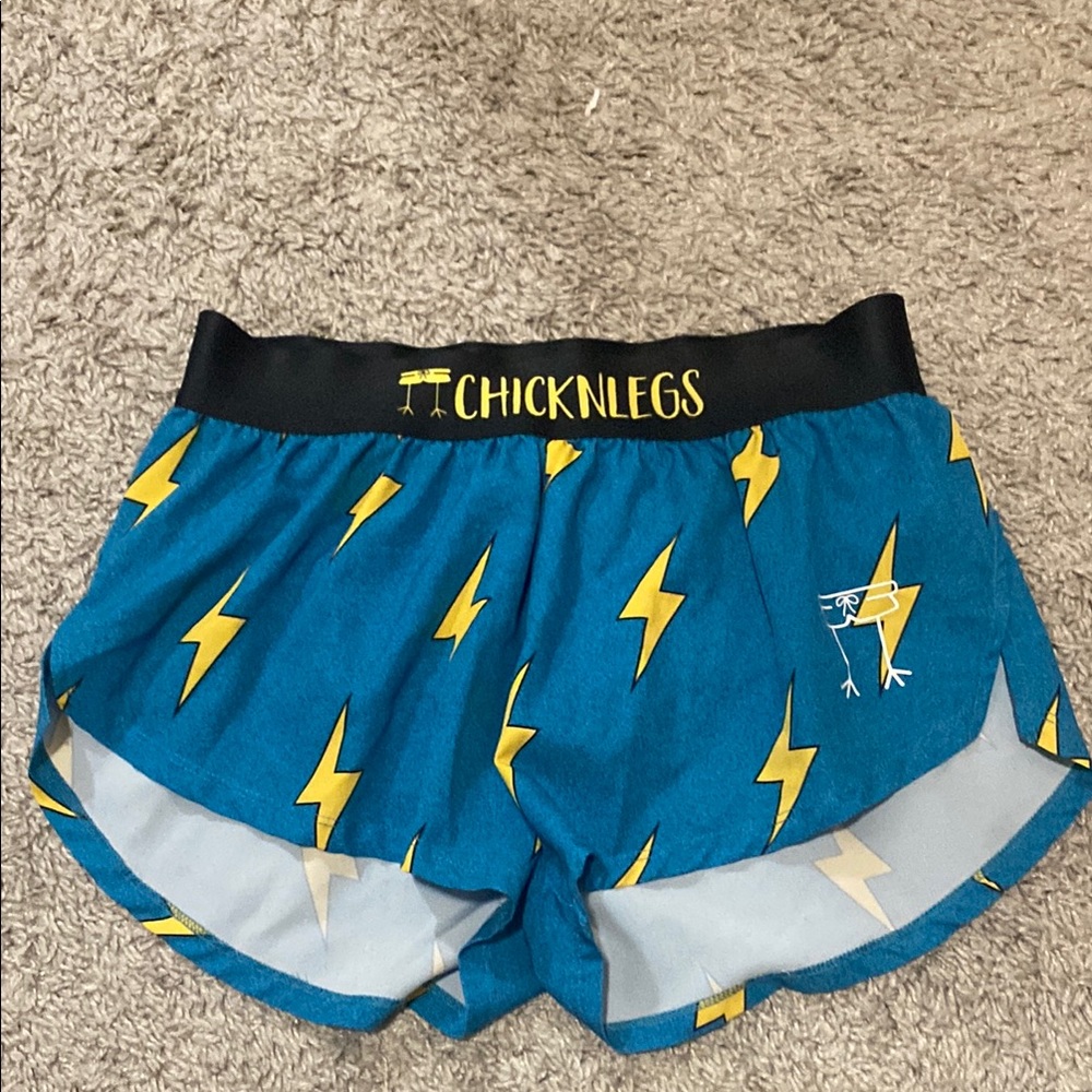 Blue Athletic Shorts with Lightning Bolt Design